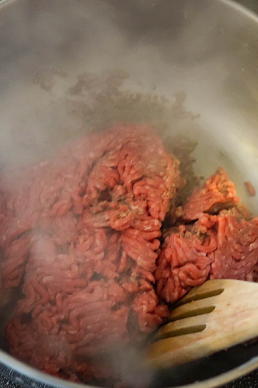 raw ground beef in a pot