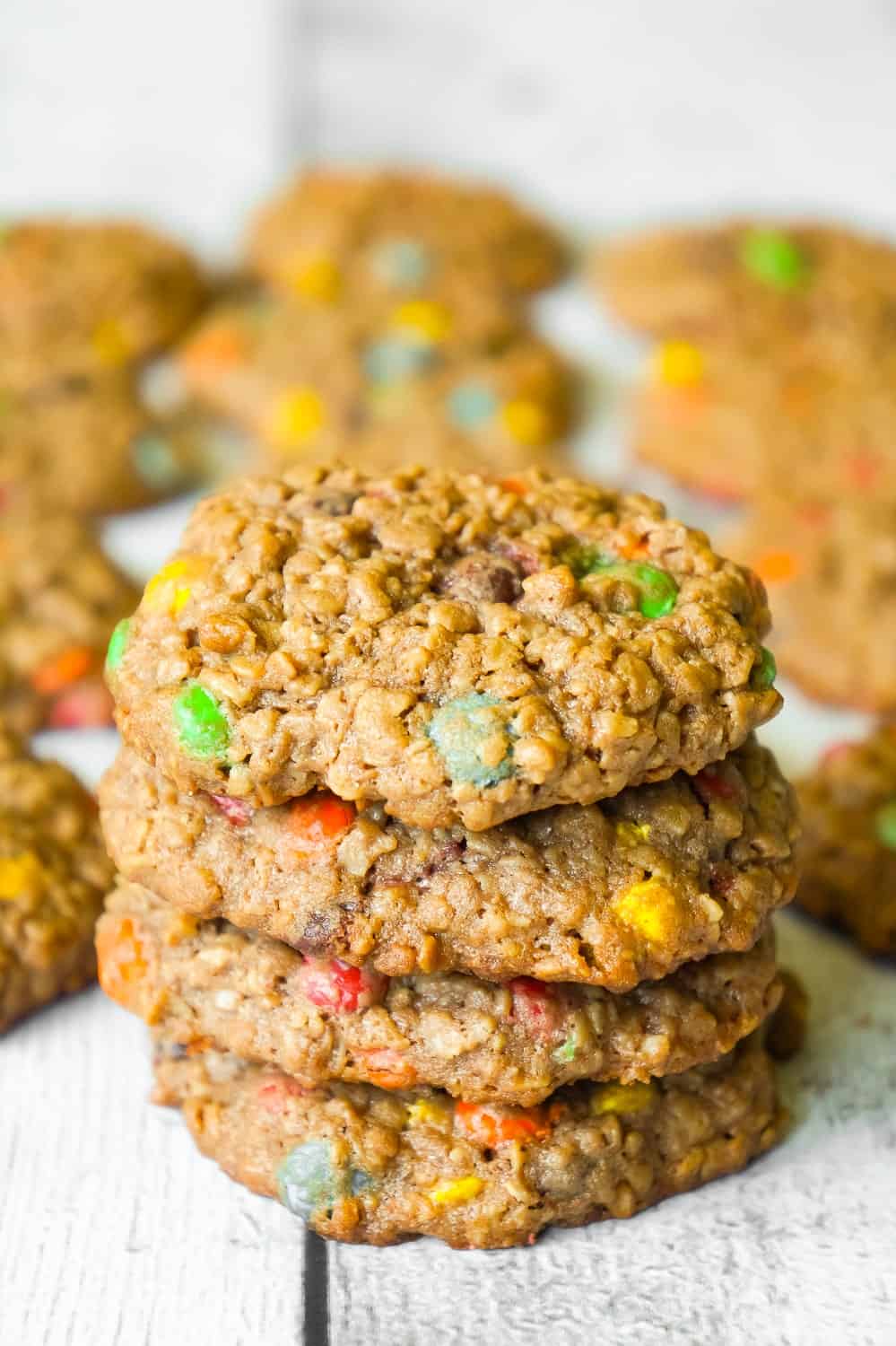 Chocolate Monster Cookies are an easy peanut butter dessert recipe using quick oats and mini M&M's. These chewy peanut butter cookies with cocoa powder are a delicious twist on the classic Monster Cookie.