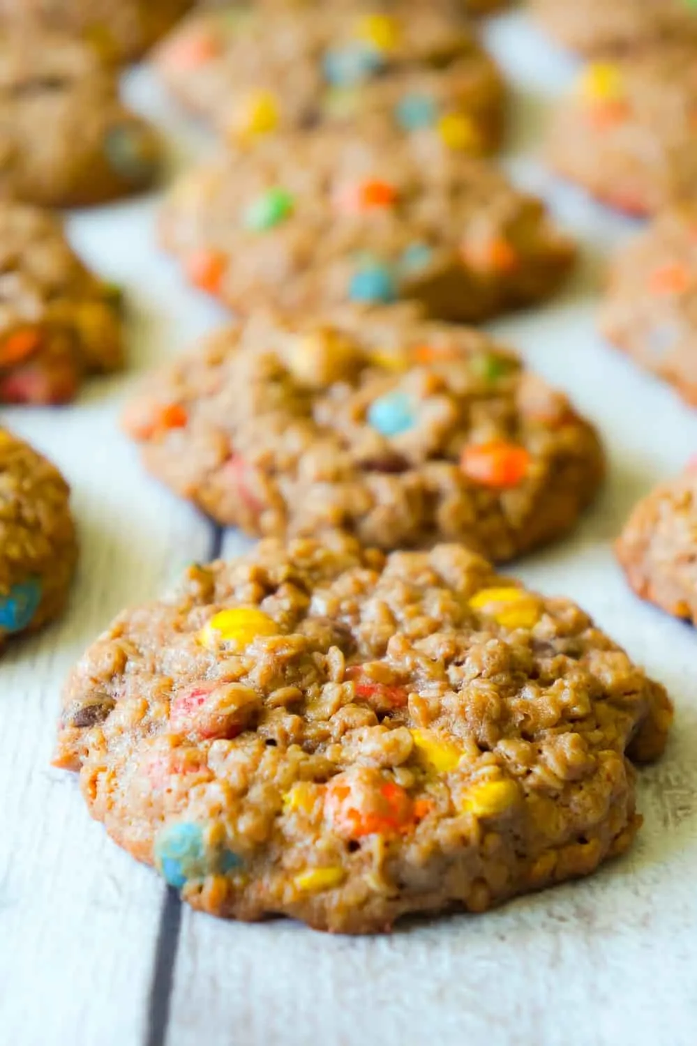 Chocolate Monster Cookies are an easy peanut butter dessert recipe using quick oats and mini M&M's. These chewy peanut butter cookies with cocoa powder are a delicious twist on the classic Monster Cookie.