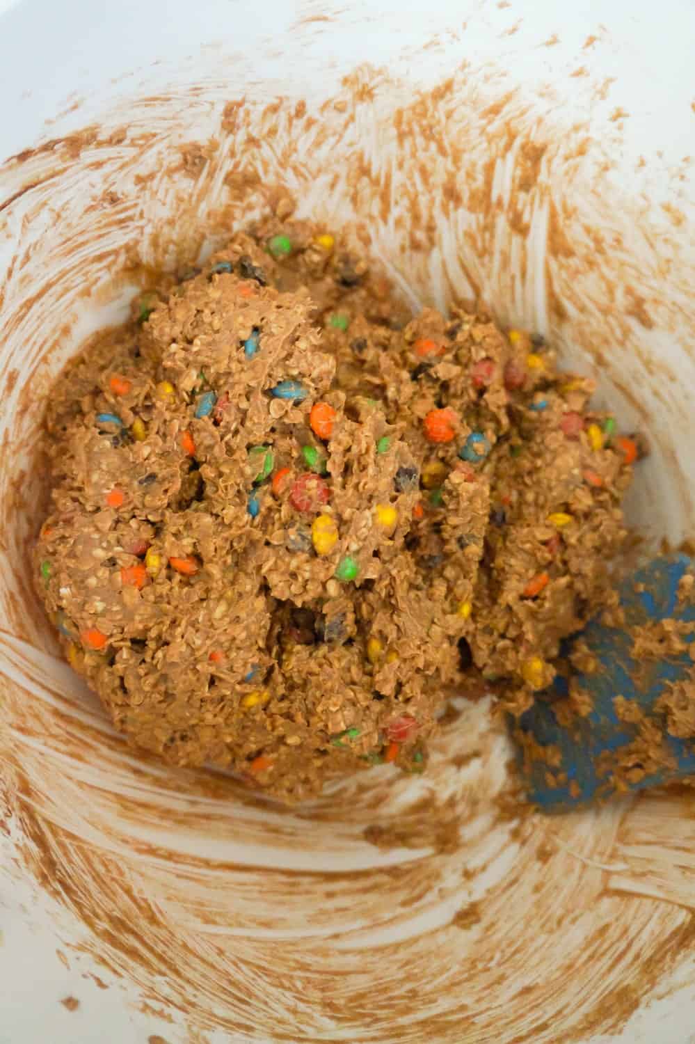 chocolate monster cookie dough in a mixing bowl