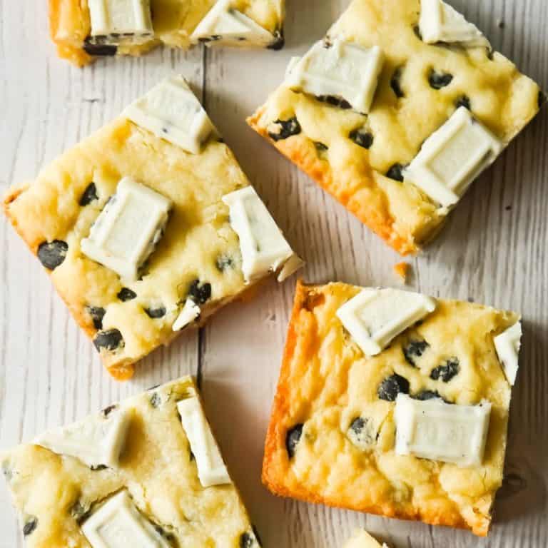 Cookies and Cream Sugar Cookie Bars are chewy sugar cookies made with vanilla pudding mix and loaded with Hershey's Cookies 'n' Creme baking bits and snack size Hershey's Cookies 'n' Creme bars.