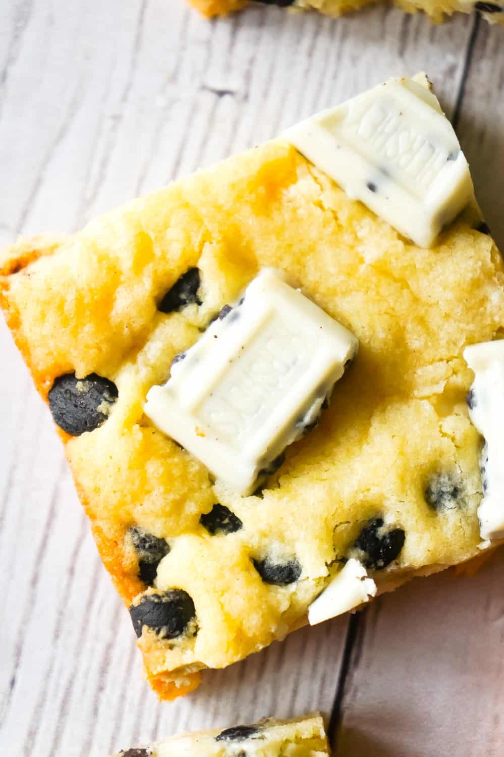 Cookies and Cream Sugar Cookie Bars are chewy sugar cookies made with vanilla pudding mix and loaded with Hershey's Cookies 'n' Creme baking bits and snack size Hershey's Cookies 'n' Creme bars.