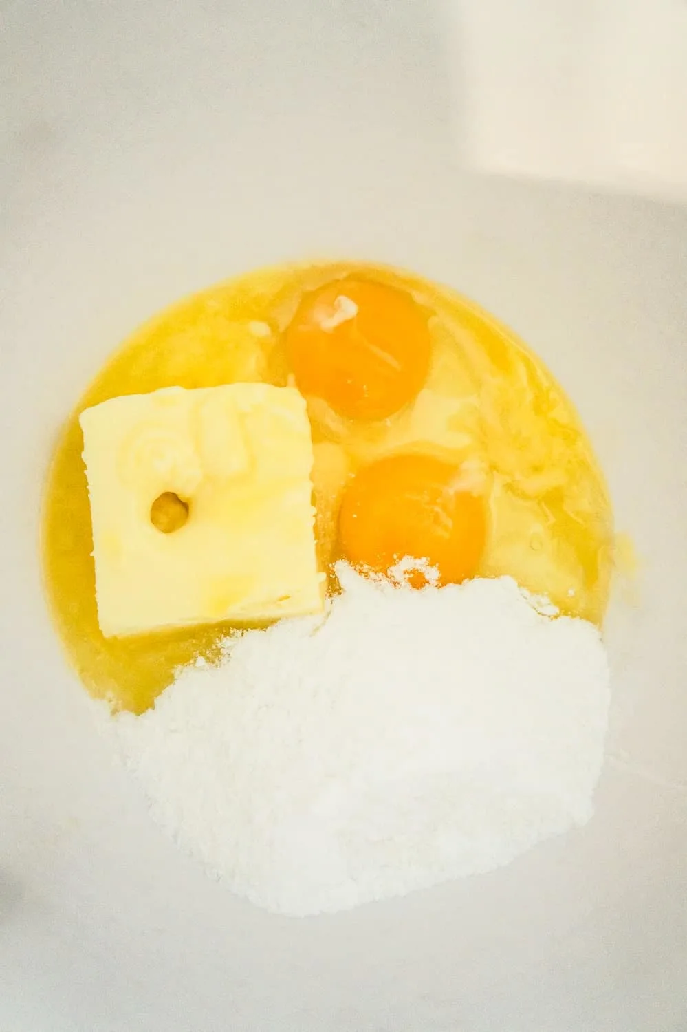 softened butter, eggs and sugar cookie mix in a mixing bowl