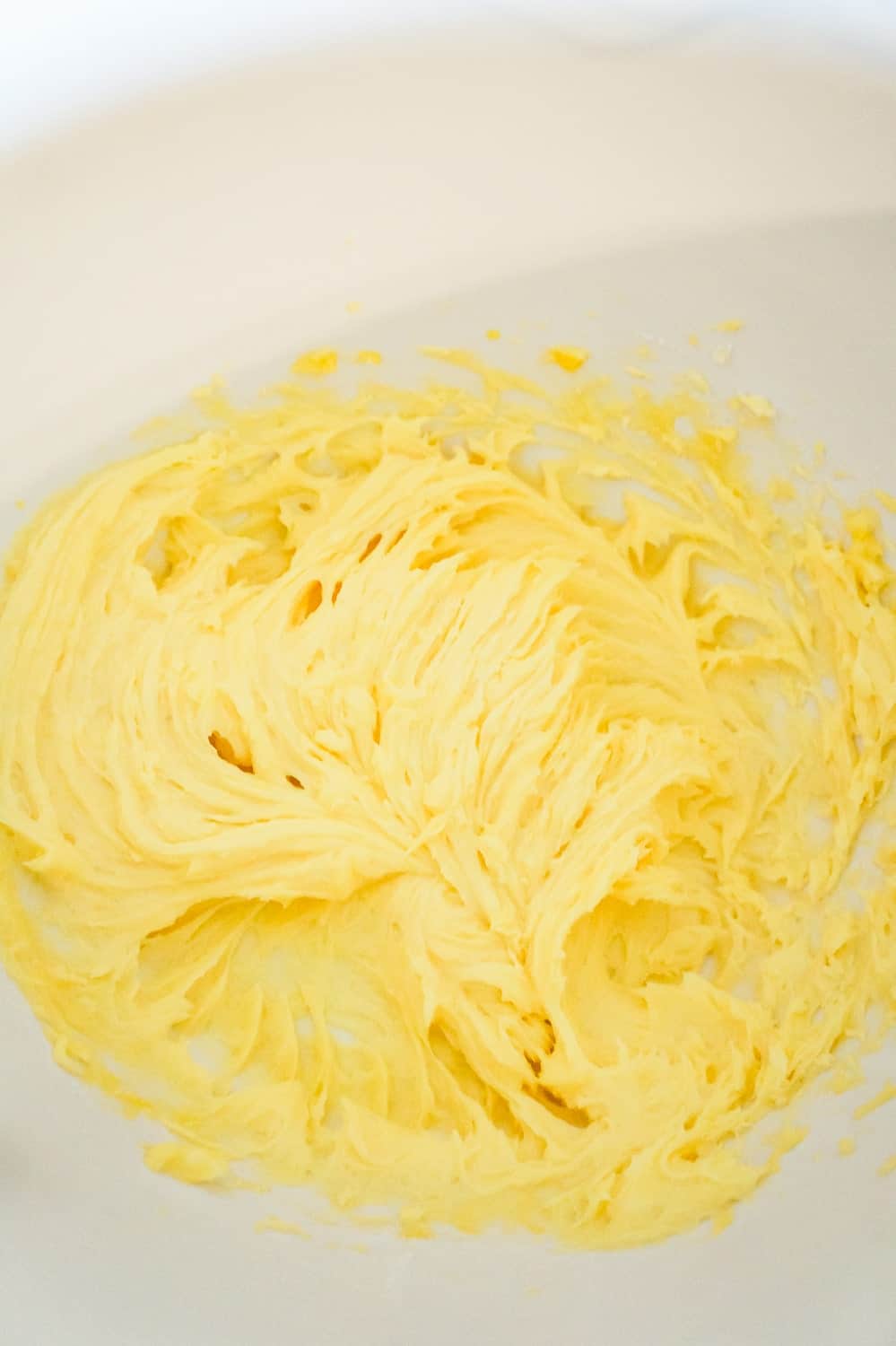 butter, eggs and vanilla pudding mix creamed together in a mixing bowl