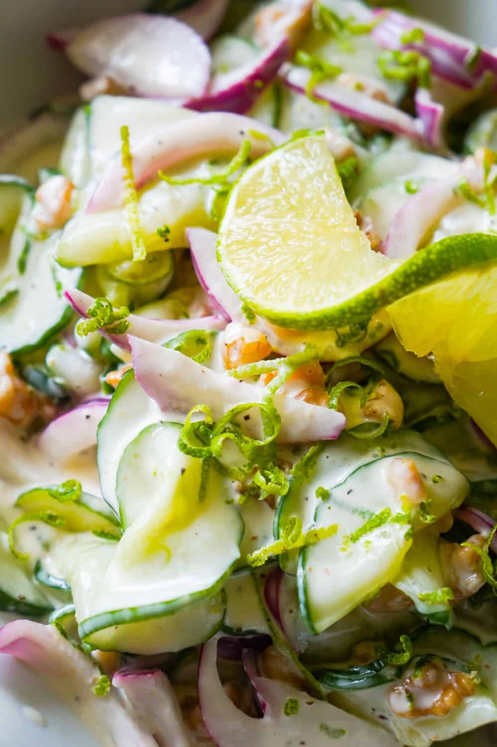 Creamy Cucumber Salad with Lime is a delicious summer side dish recipe using English cucumbers, fresh limes, red onions and chopped walnuts.