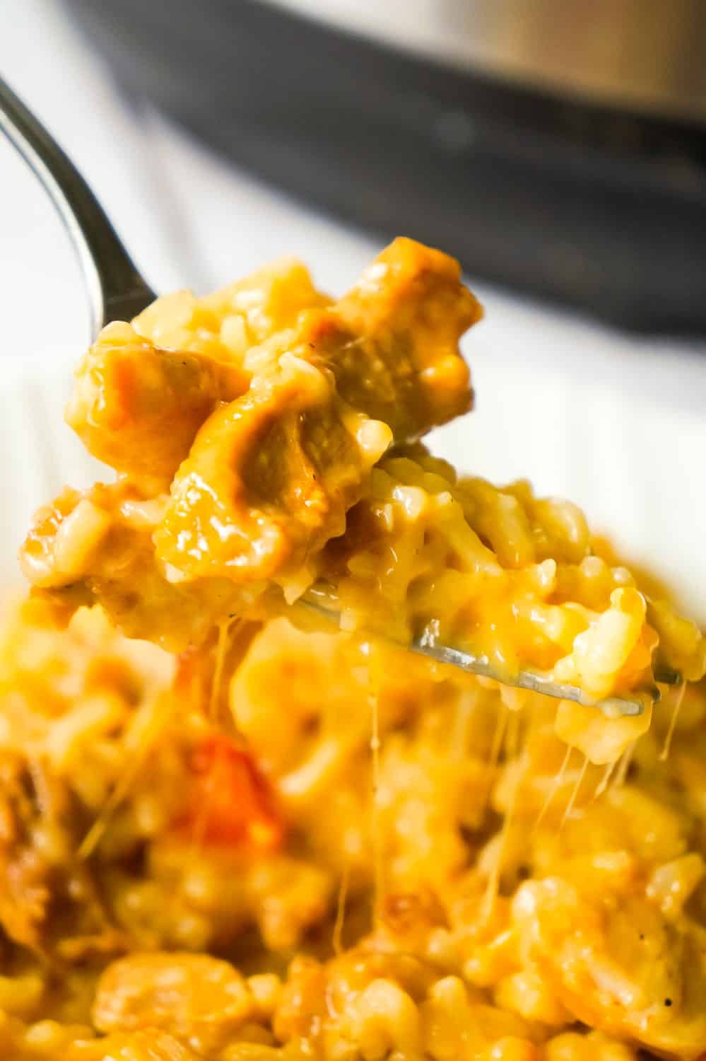 Instant Pot Cheesy Fajita Chicken and Rice is a delicious pressure cooker chicken thigh recipe loaded with peppers and fajita seasoning.