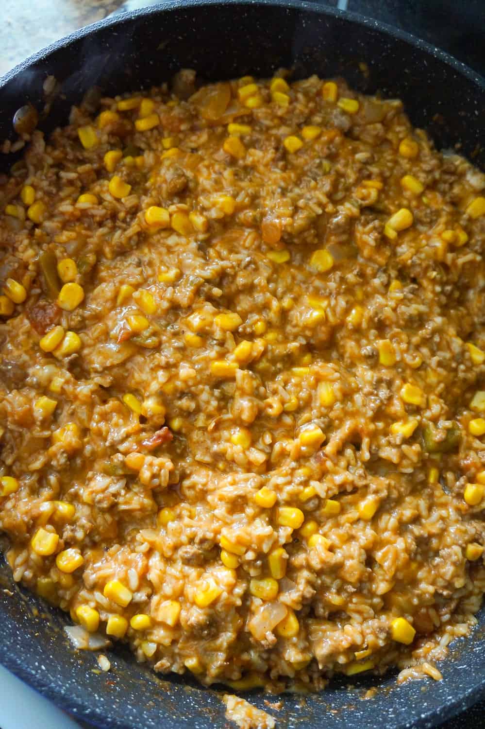 cheesy ground beef and rice in a skillet