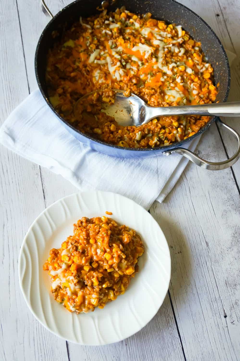One Pot Mexican Ground Beef and Rice is a stove top dinner recipe loaded with ground beef, rice, salsa, corn and cheese. This cheesy ground beef and rice casserole is an easy dinner recipe perfect for weeknights.