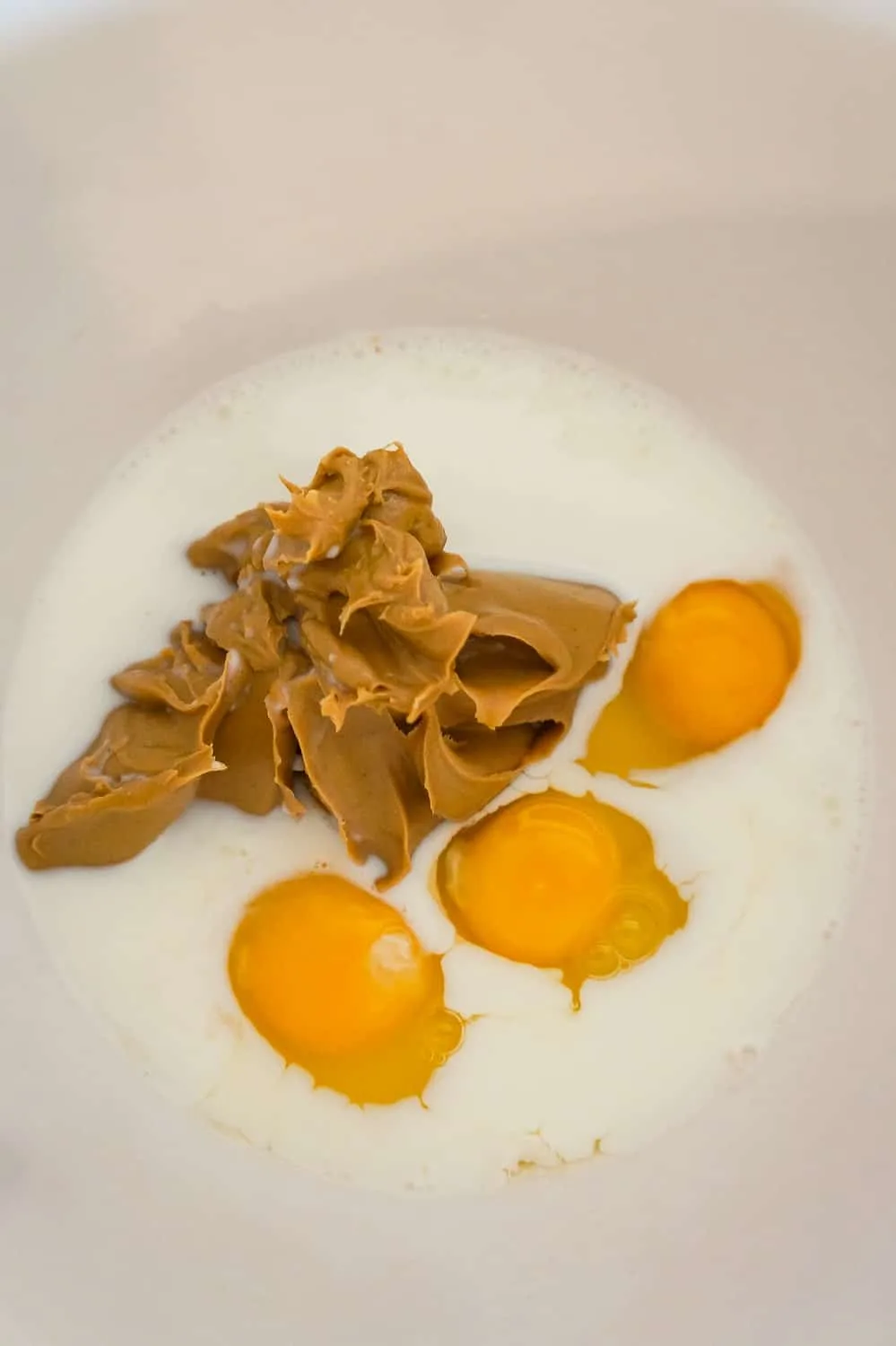 milk, smooth peanut butter and eggs in a mixing bowl