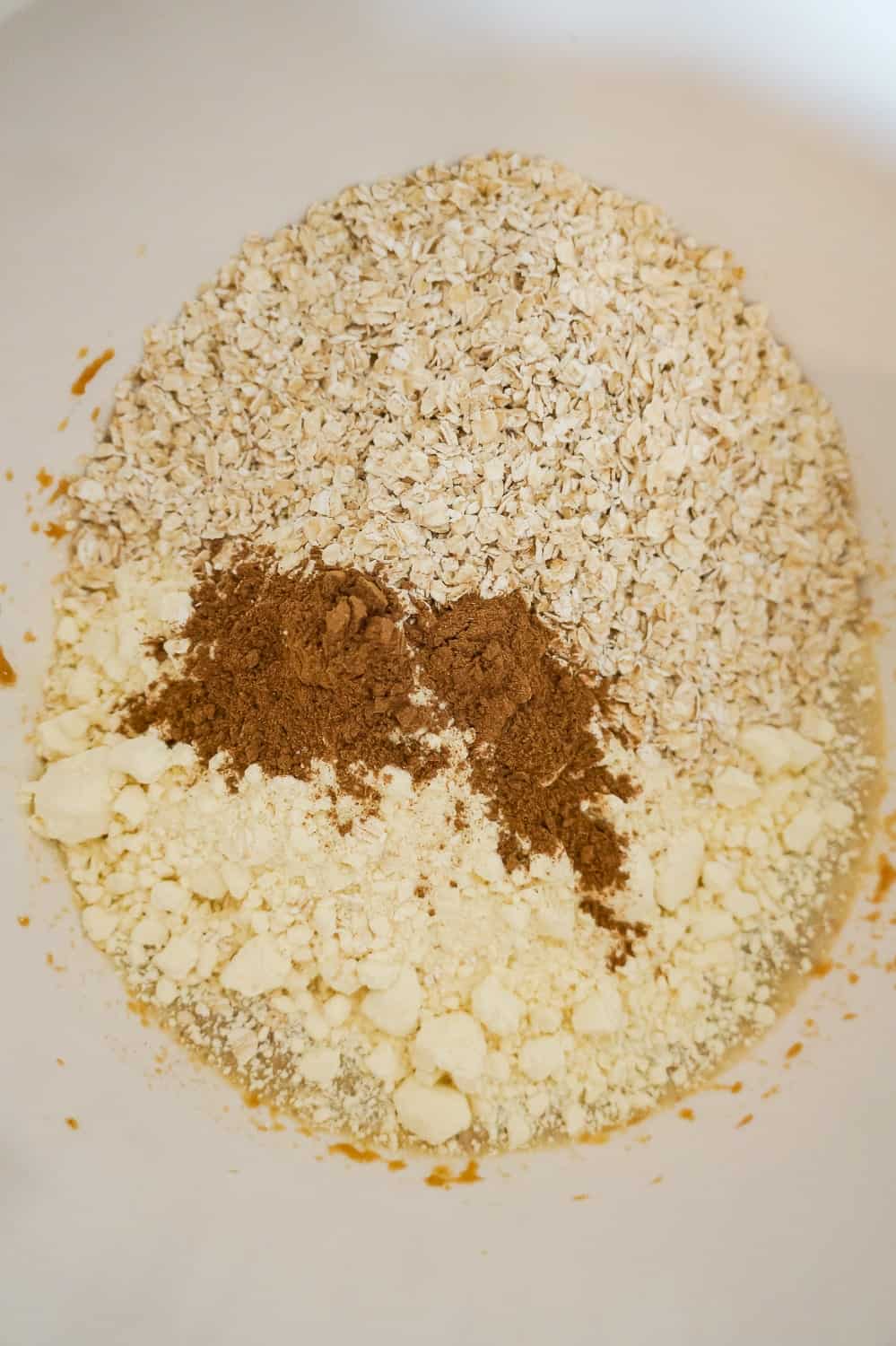 cake mix, pumpkin pie spice and quick oats in a mixing bowl