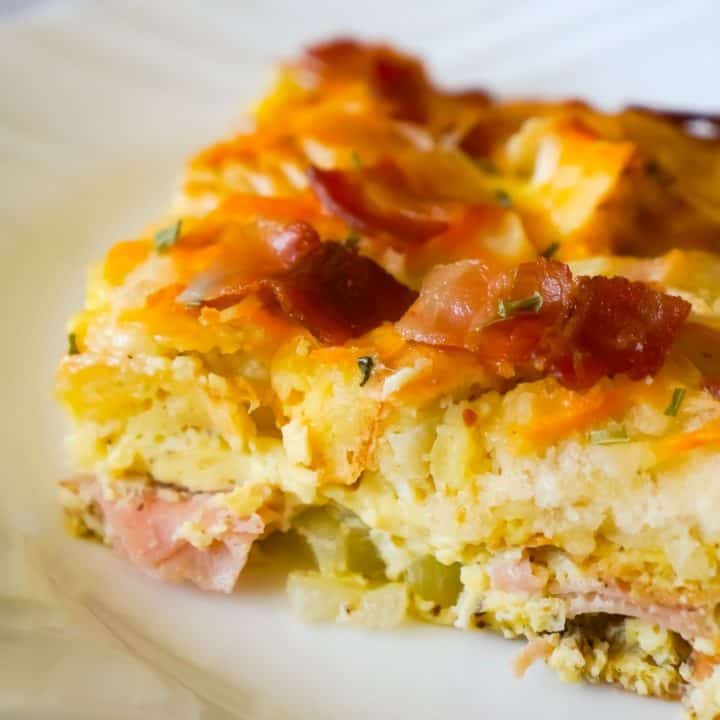 Bagel Breakfast Casserole with Eggs, Ham and Bacon is an easy brunch recipe made with chopped plain bagels loaded with eggs, sliced honey ham and crumbled bacon.