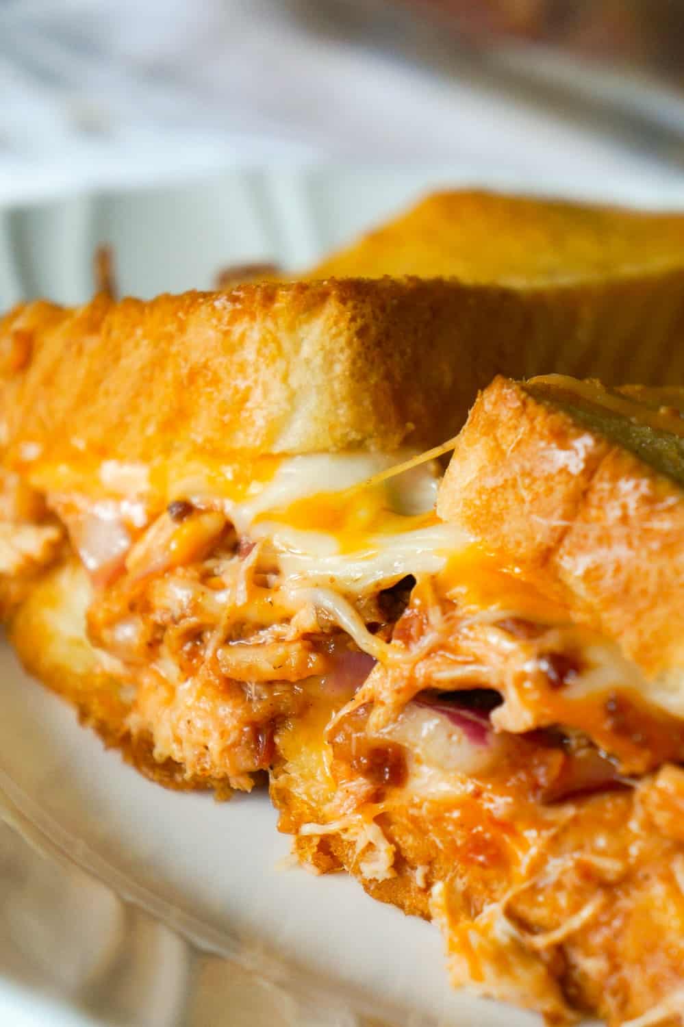 BBQ Chicken Grilled Cheese Casserole is an easy weeknight dinner recipe using shredded rotisserie chicken and loaded with BBQ sauce, bacon, cheddar and mozzarella.