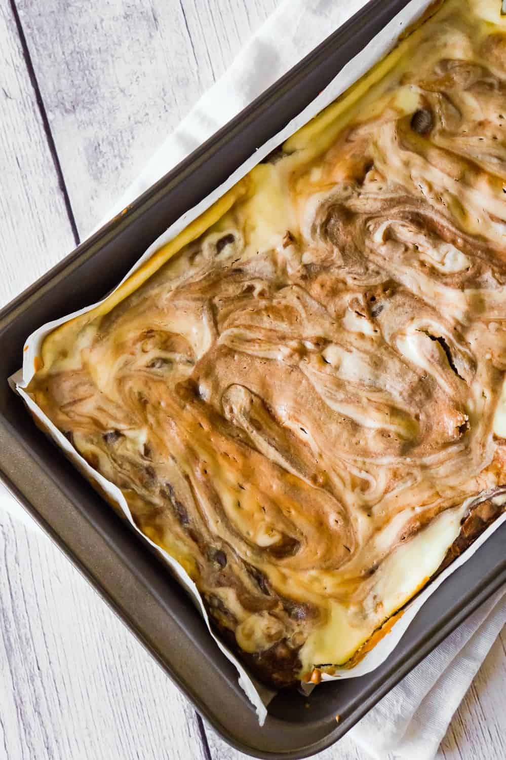 Brownies with Cream Cheese are a decadent chocolate dessert loaded with chocolate chips and a rich cheesecake swirl.