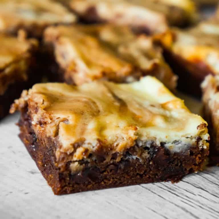 Brownies with Cream Cheese are a decadent chocolate dessert loaded with chocolate chips and a rich cheesecake swirl.