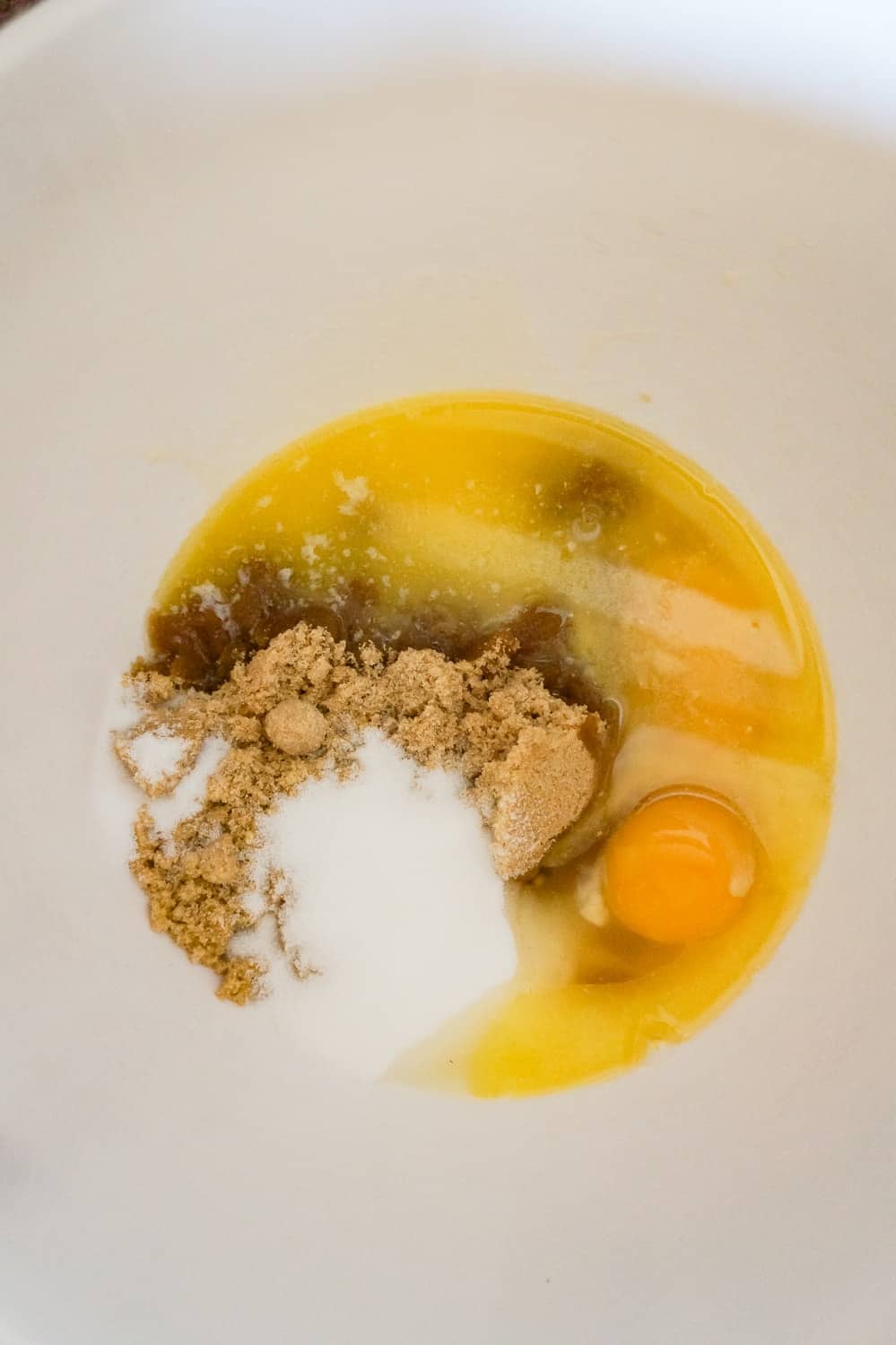 brown sugar, granulated sugar, eggs and melted butter in a mixing bowl