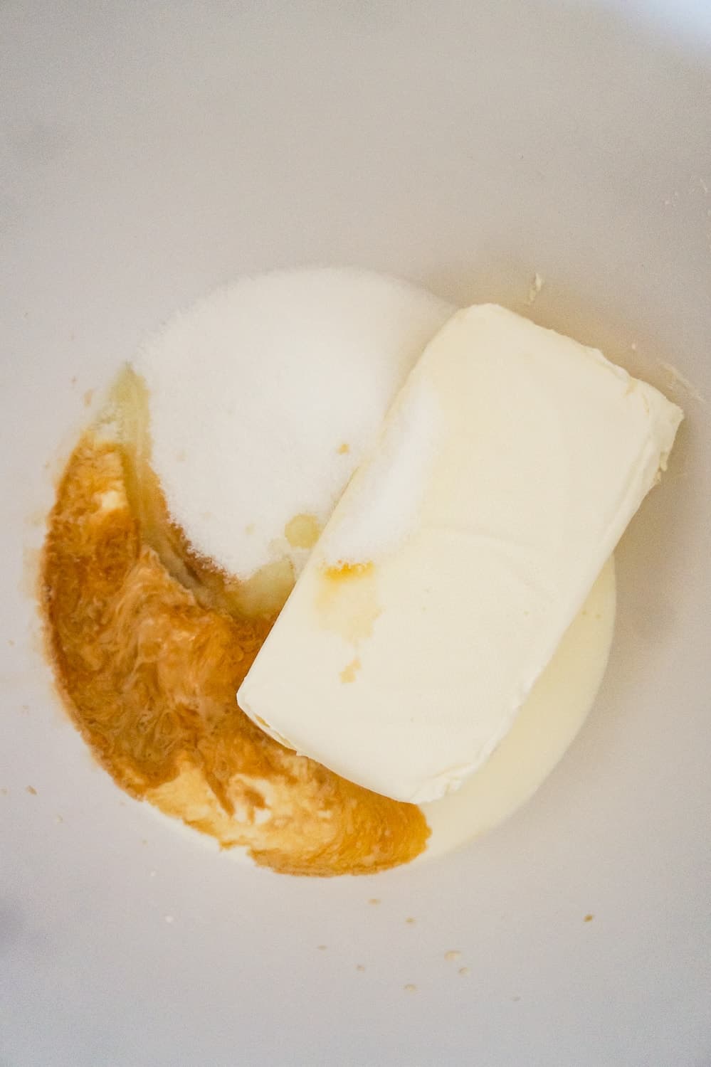 cream cheese, sugar, cream and vanilla extract in a mixing bowl