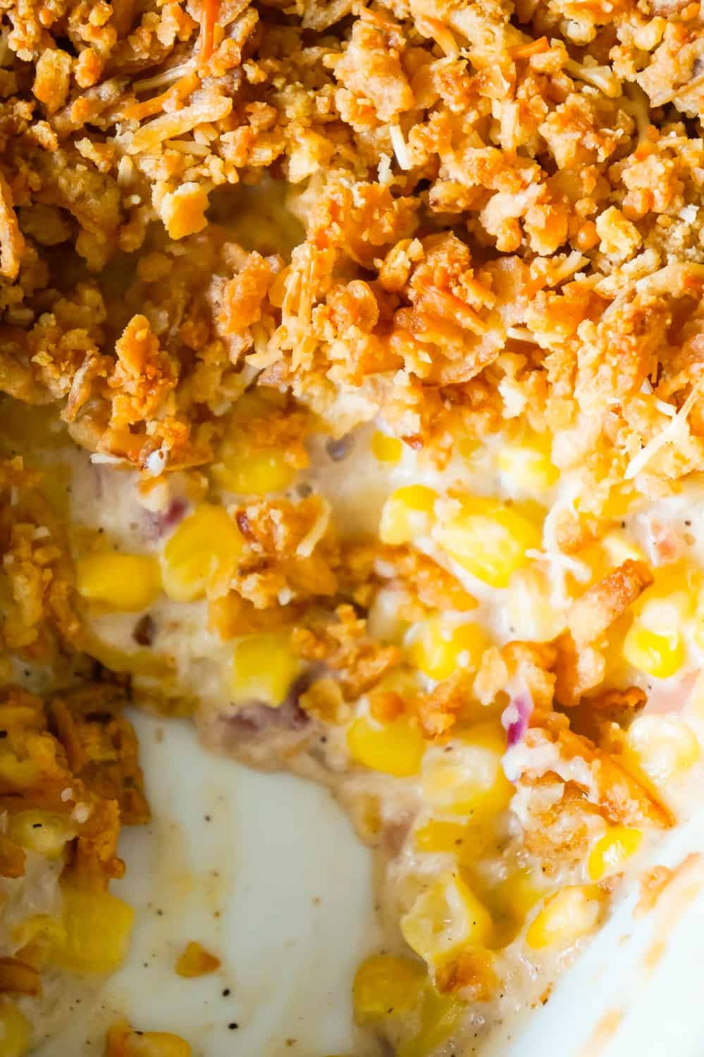 Cream Corn Casserole is an easy side dish recipe loaded with cream of bacon soup, red onions, Parmesan cheese, Ritz crackers and French's fried onions.