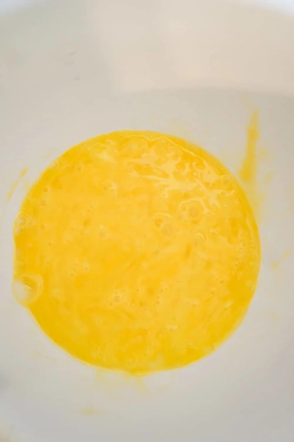 beaten egg in a mixing bowl