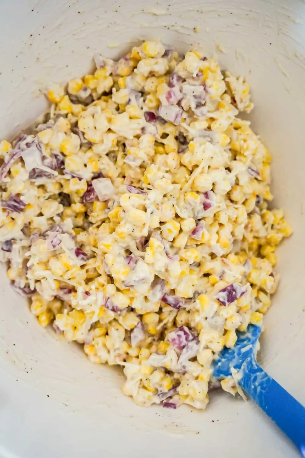 corn, red onions and cream soup mixture in a mixing bowl
