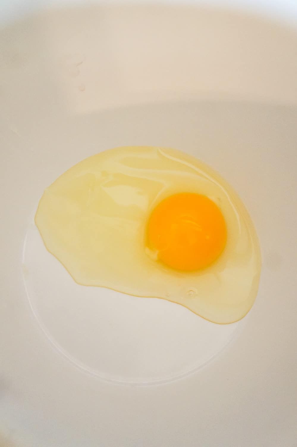 an egg in a mixing bowl
