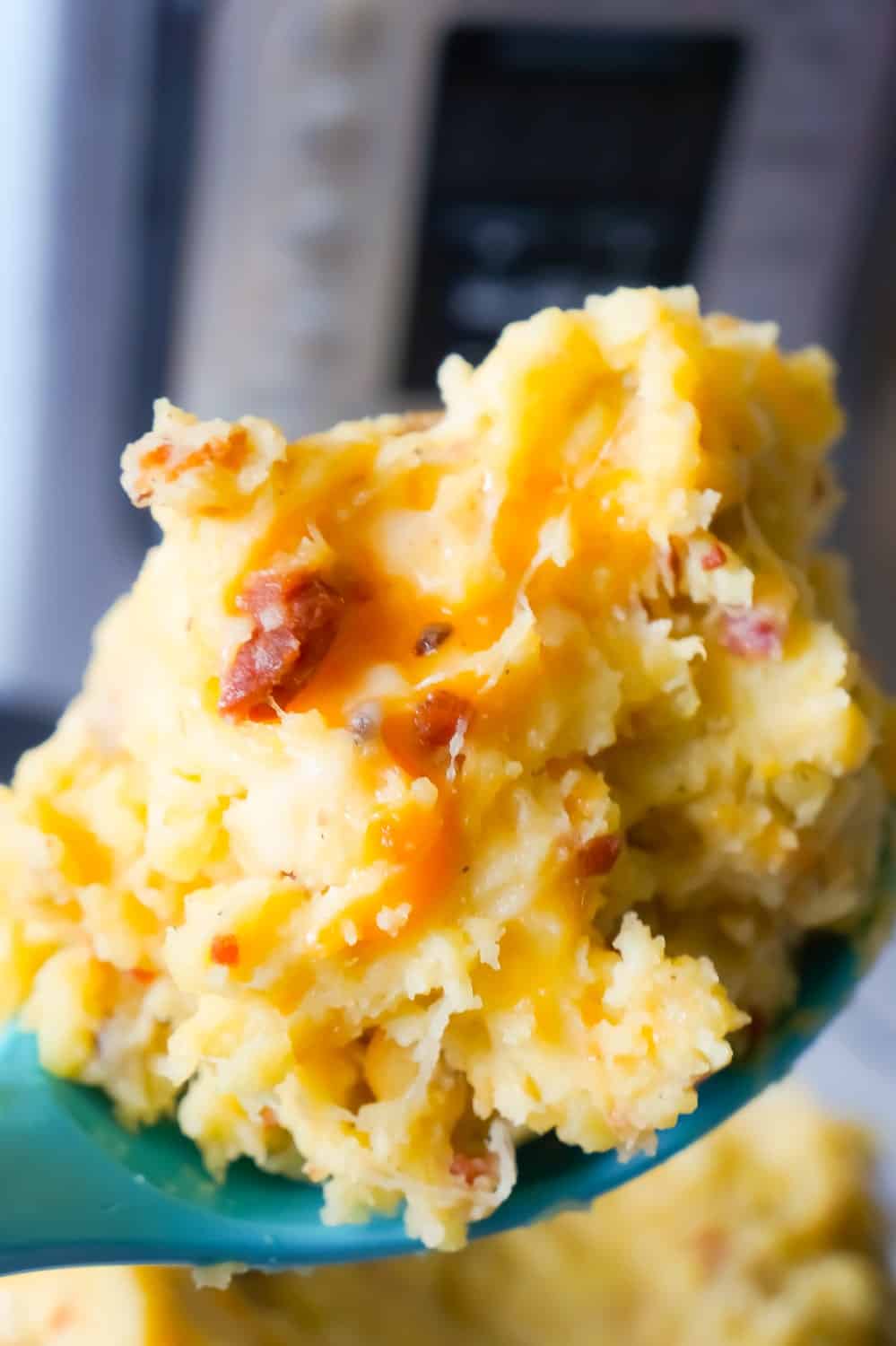 Instant Pot Cheesy Bacon Mashed Potatoes are a delicious pressure cooker side dish recipe using cream of bacon soup, crumbled bacon, cheddar and mozzarella cheese.