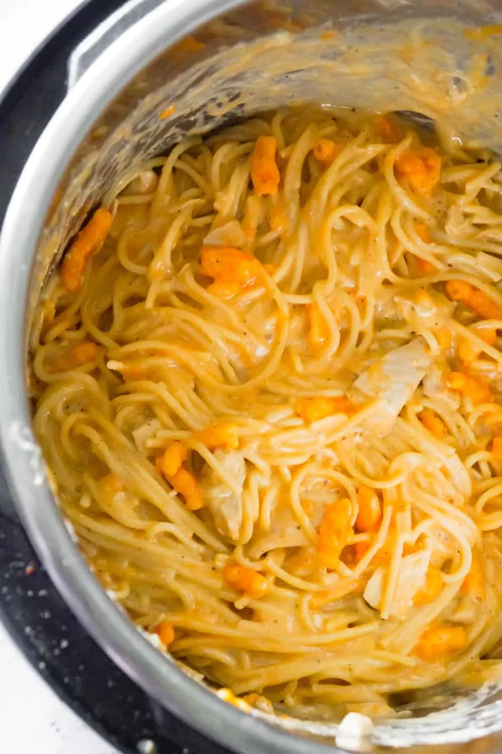 Instant Pot Cheesy Chicken Spaghetti is an easy pressure cooker spaghetti recipe loaded with chicken breast chunks, mozzarella cheese, cheddar cheese and Cheetos.