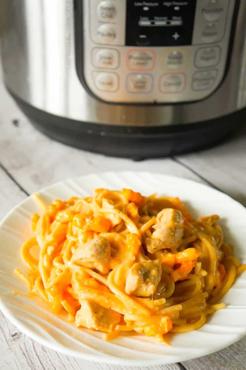 Instant Pot Cheesy Chicken Spaghetti is an easy pressure cooker spaghetti recipe loaded with chicken breast chunks, mozzarella cheese, cheddar cheese and Cheetos.