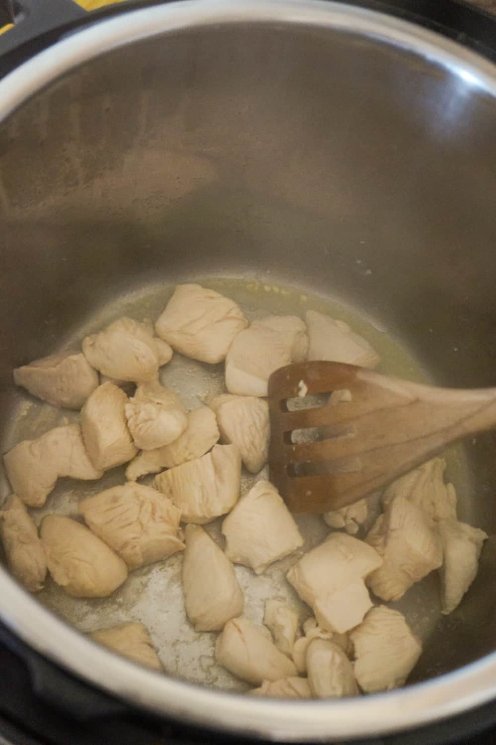 chicken breast chunks cooking in an Instant Pot