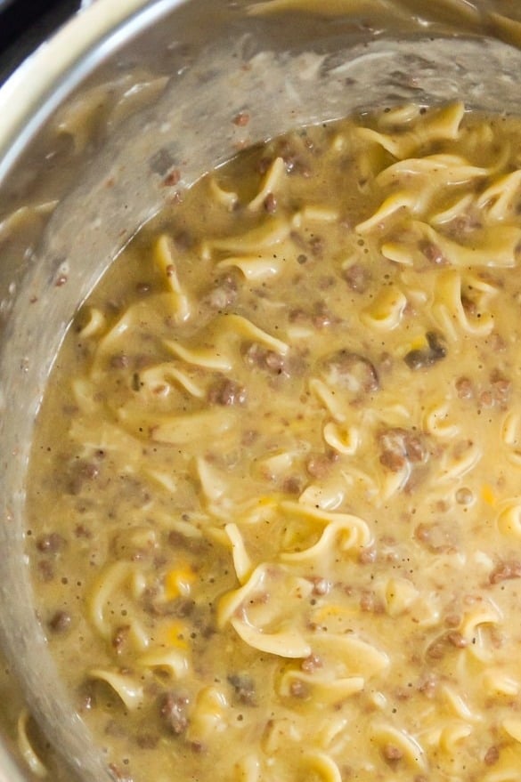 Instant Pot Cheesy Ground Beef and Noodles is an easy pressure cooker dinner recipe using hamburger meat and egg noodles loaded with mozzarella and cheddar cheese.