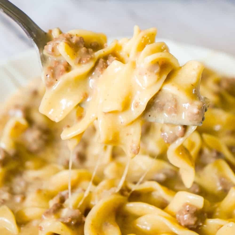 Instant Pot Cheesy Ground Beef and Noodles is an easy pressure cooker dinner recipe using hamburger meat and egg noodles loaded with mozzarella and cheddar cheese.