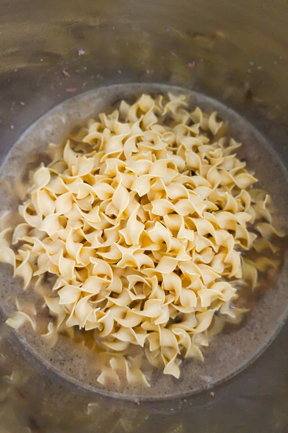 uncooked egg noodles in an Instant Pot