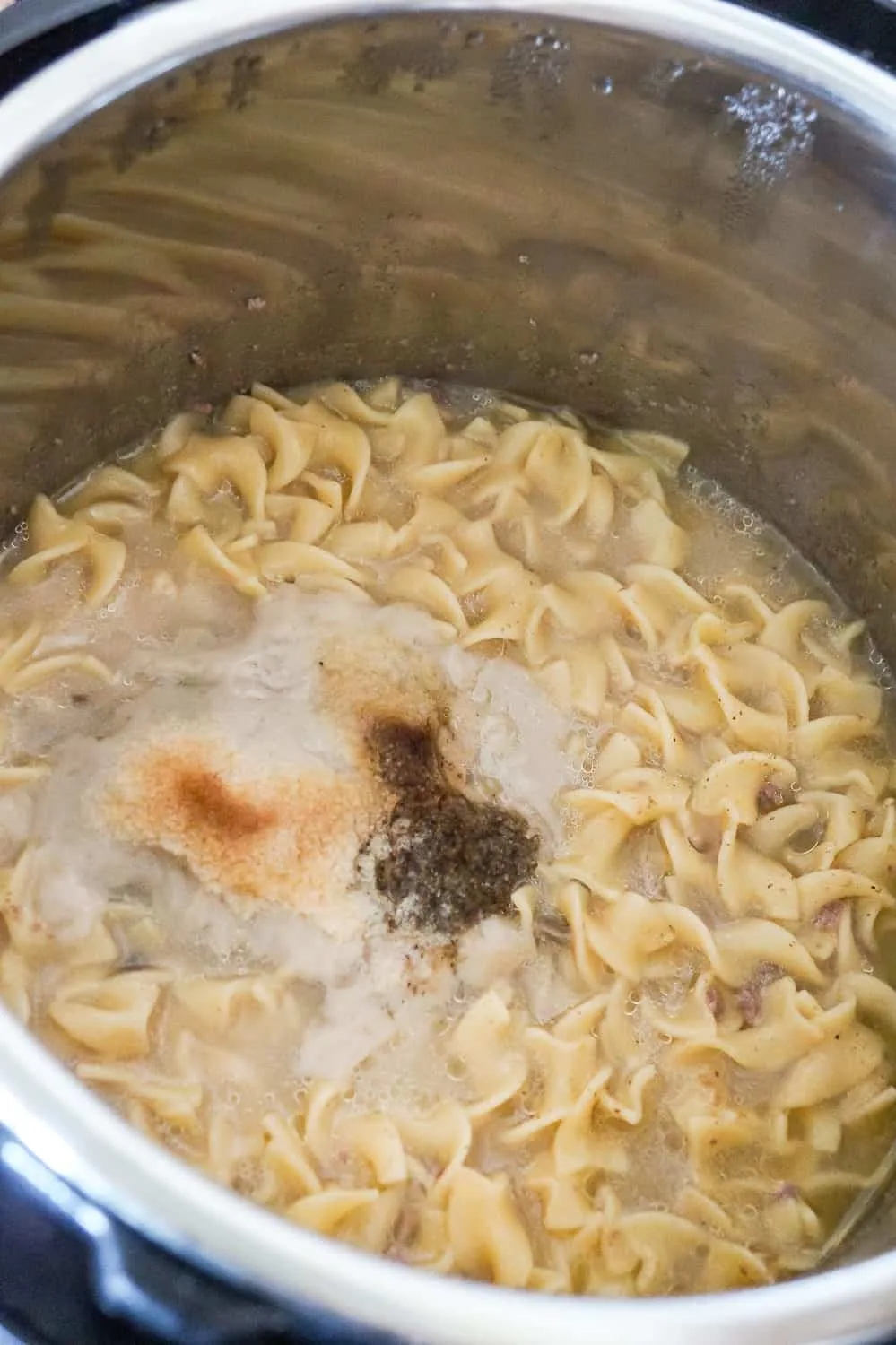 creamy egg noodles and ground beef in an Instant Pot right after removing the lid
