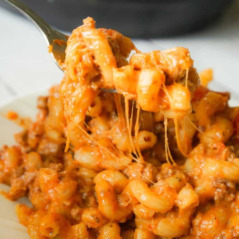 Instant Pot Cheesy Hamburger Macaroni is an easy pressure cooker pasta recipe loaded with ground beef, marinara, cheddar and mozzarella cheese.