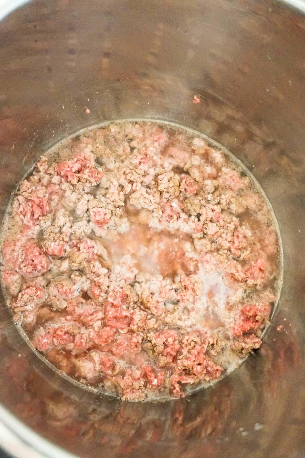ground beef and water in an Instant Pot