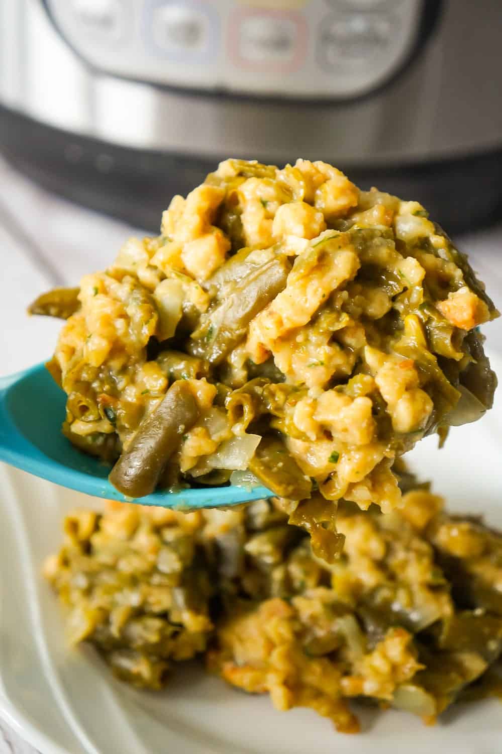 Instant Pot Green Bean Casserole with Stuffing is an easy pressure cooker side dish recipe made with cut green beans, cream of mushroom soup and Stove Top stuffing mix.