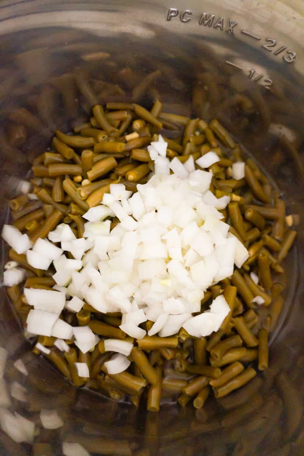 diced onions and green beans in an Instant Pot