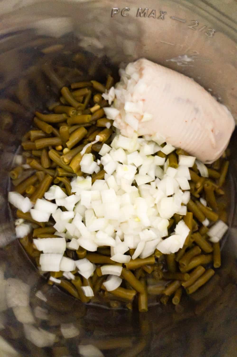 cream of mushroom soup, diced onions and green beans in an Instant Pot before cooking