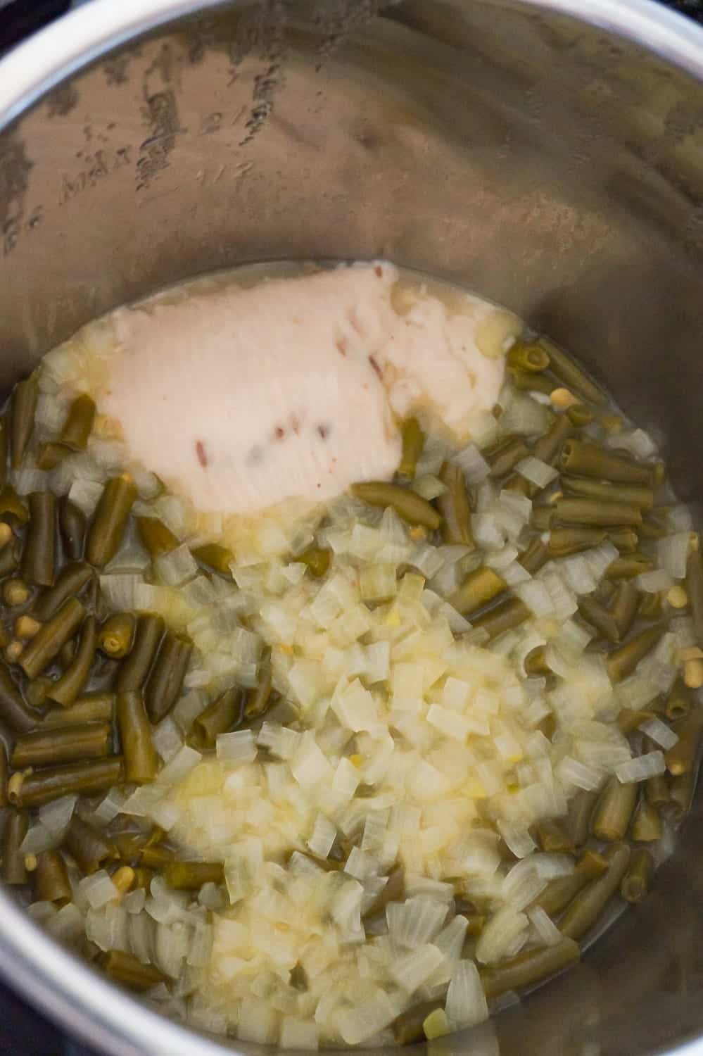 cream of mushroom soup, diced onions and green beans after cooking in an Instant Pot