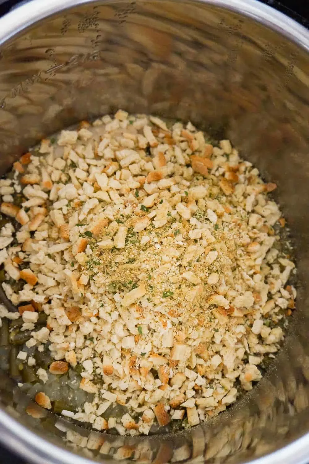 stove top stuffing mix on top of green beans in an Instant Pot