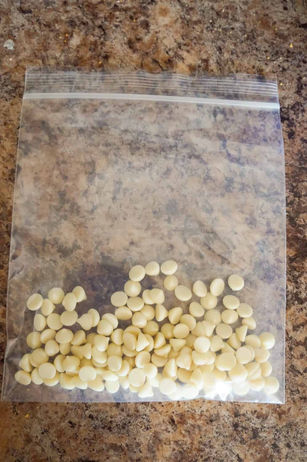 white chocolate baking chips in a ziploc bag