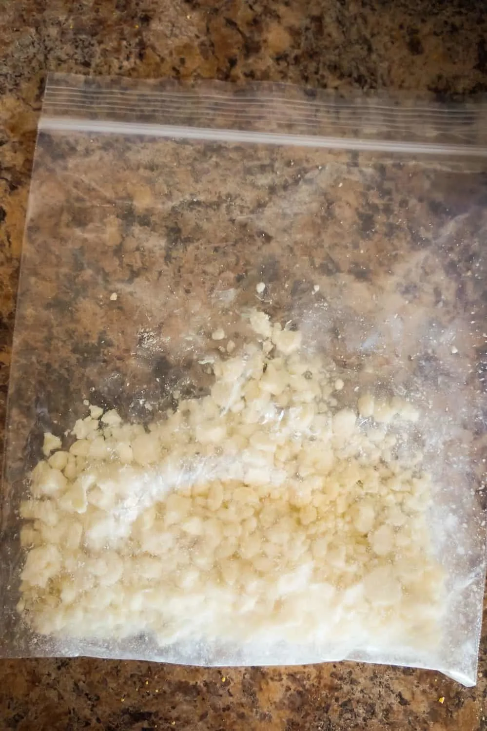 crumbled white chocolate in a ziploc bag