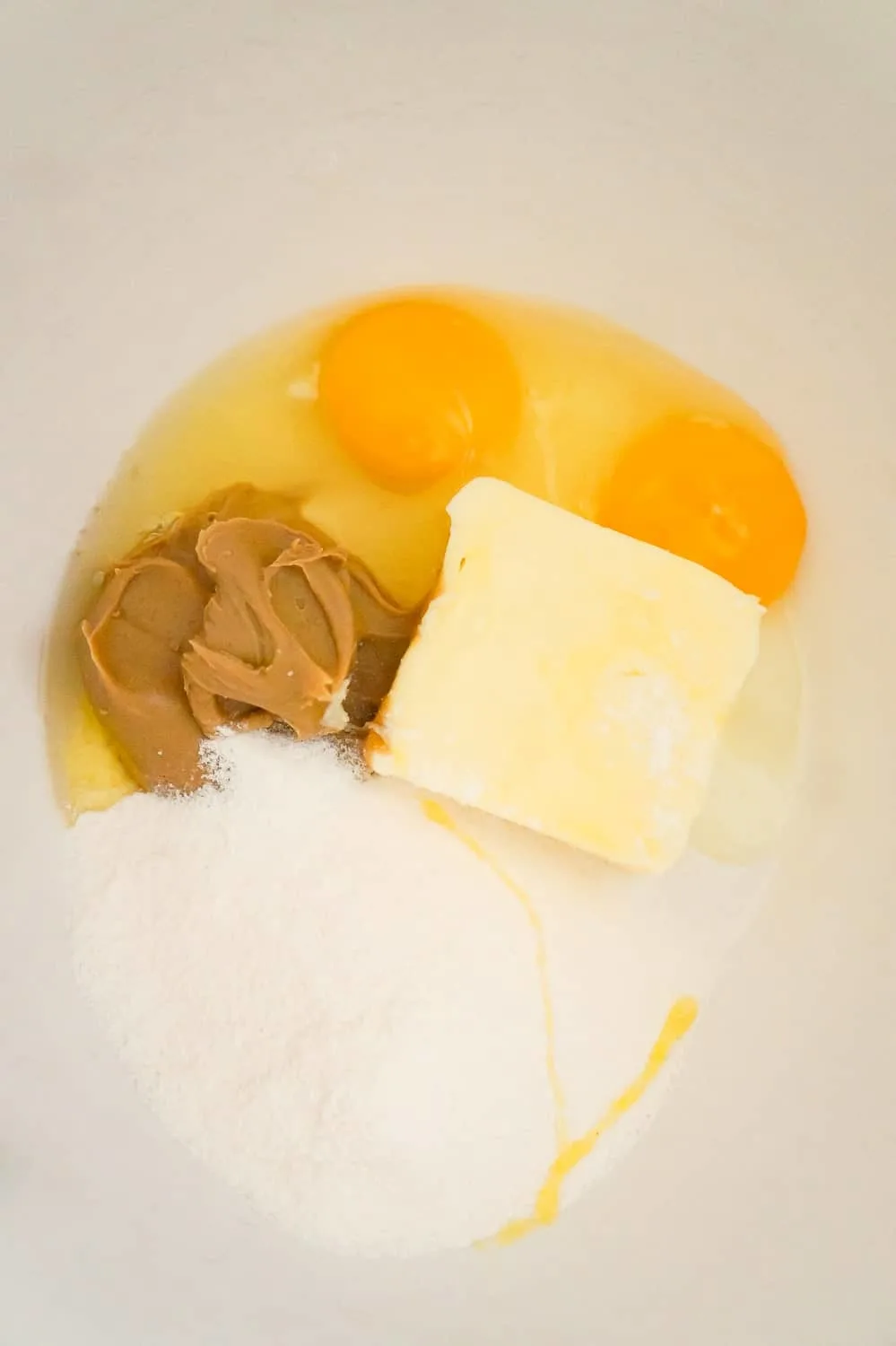 peanut butter, butter, eggs and banana instant pudding mix in a mixing bowl