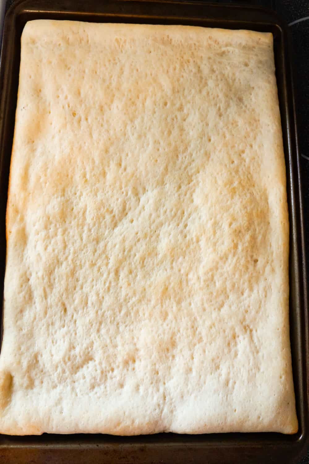 rectangular Pillsbury pizza crust after pre baking