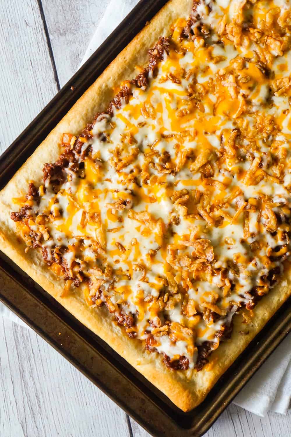 Sloppy Joe Pizza is an easy ground beef dinner recipe using Pillsbury pizza crust and homemade sloppy joe sauce.