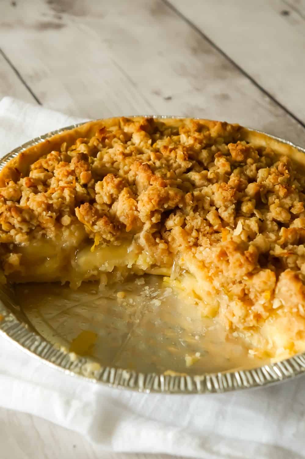 Apple Pie with Crumble Topping is an easy apple pie recipe using store bought crust and pie filling topped with a homemade crumble topping with hints of cinnamon and citrus.