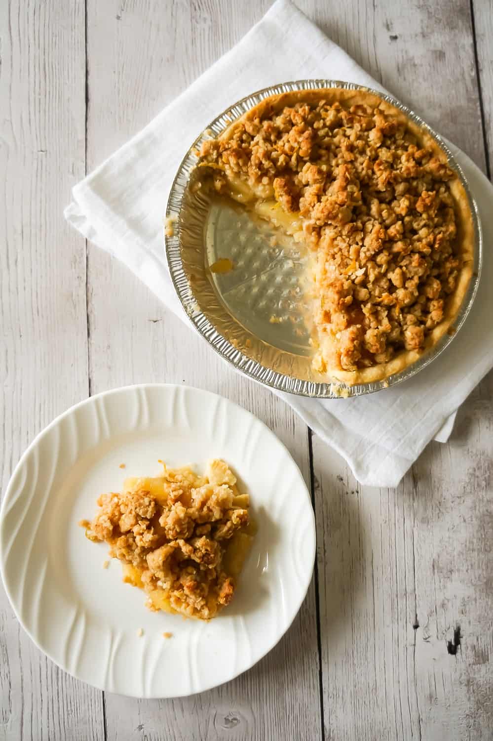 Apple Pie with Crumble Topping is an easy apple pie recipe using store bought crust and pie filling topped with a homemade crumble topping with hints of cinnamon and citrus.