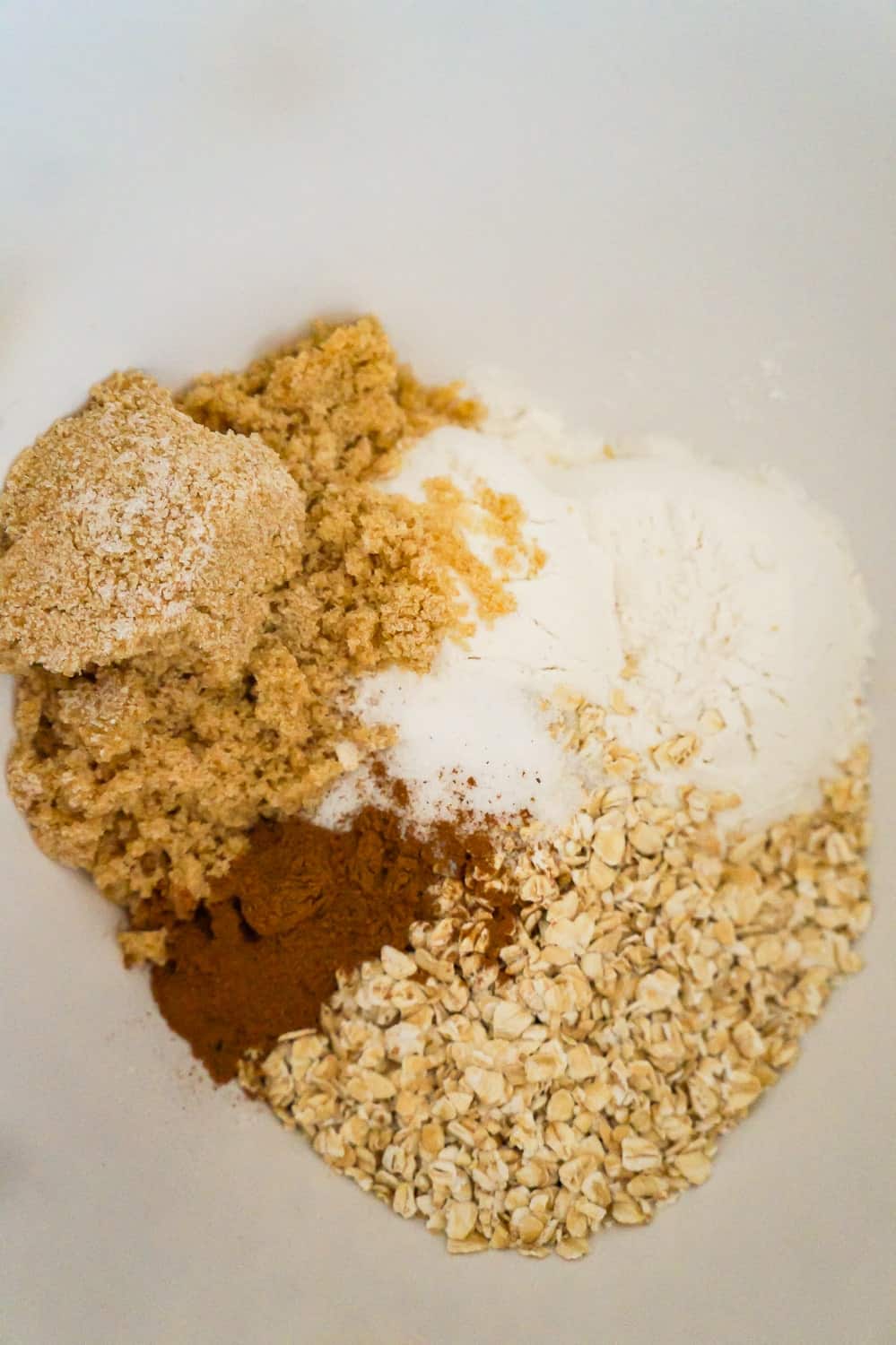brown sugar, cinnamon, flour and quick oats in a mixing bowl