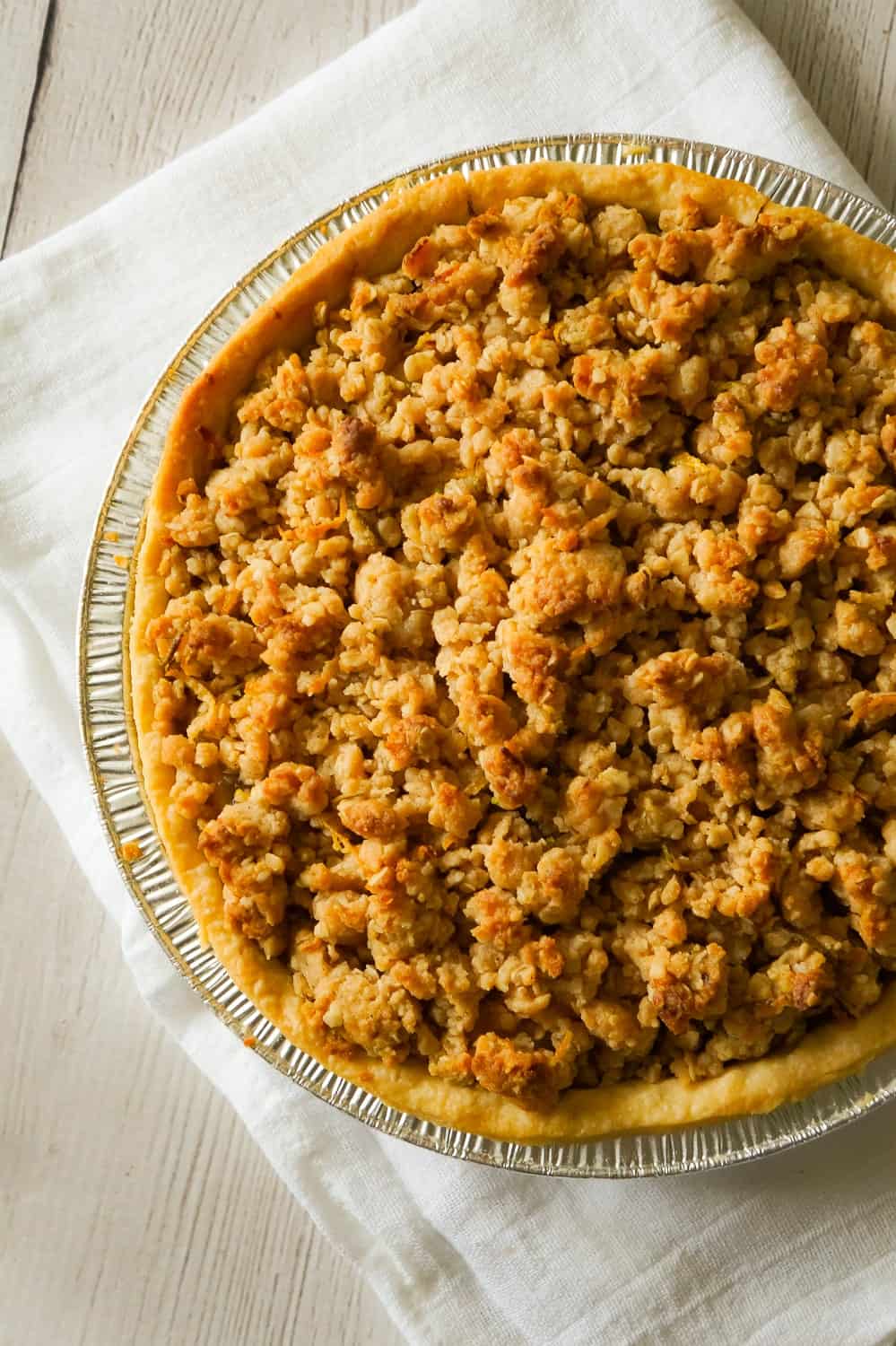 Apple Pie with Crumble Topping is an easy apple pie recipe using store bought crust and pie filling topped with a homemade crumble topping with hints of cinnamon and citrus.