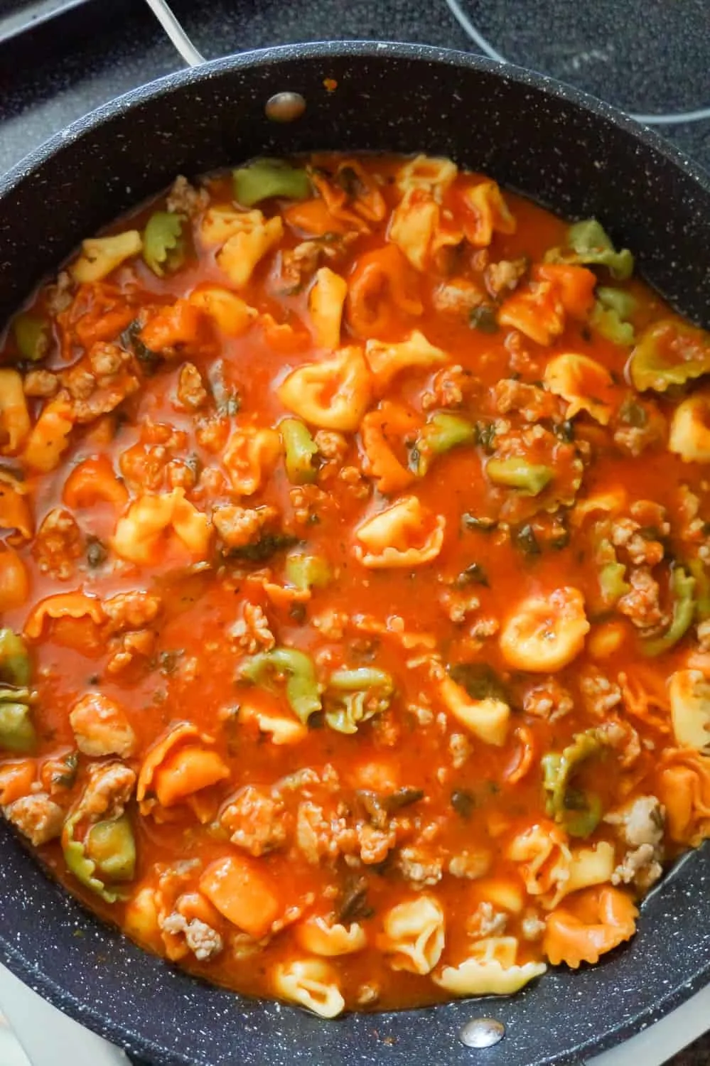 tortellini and tomato sauce in a pan