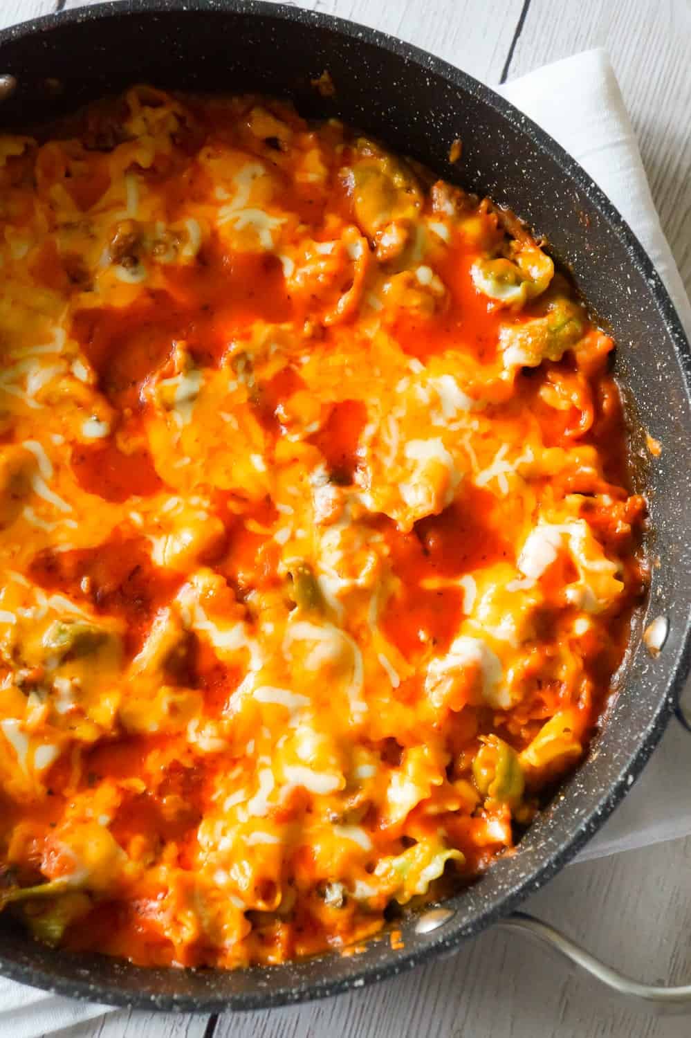 Cheesy Tortellini with Sausage is an easy one pot dinner recipe loaded with ground sausage meat and topped with mozzarella and cheddar cheese.